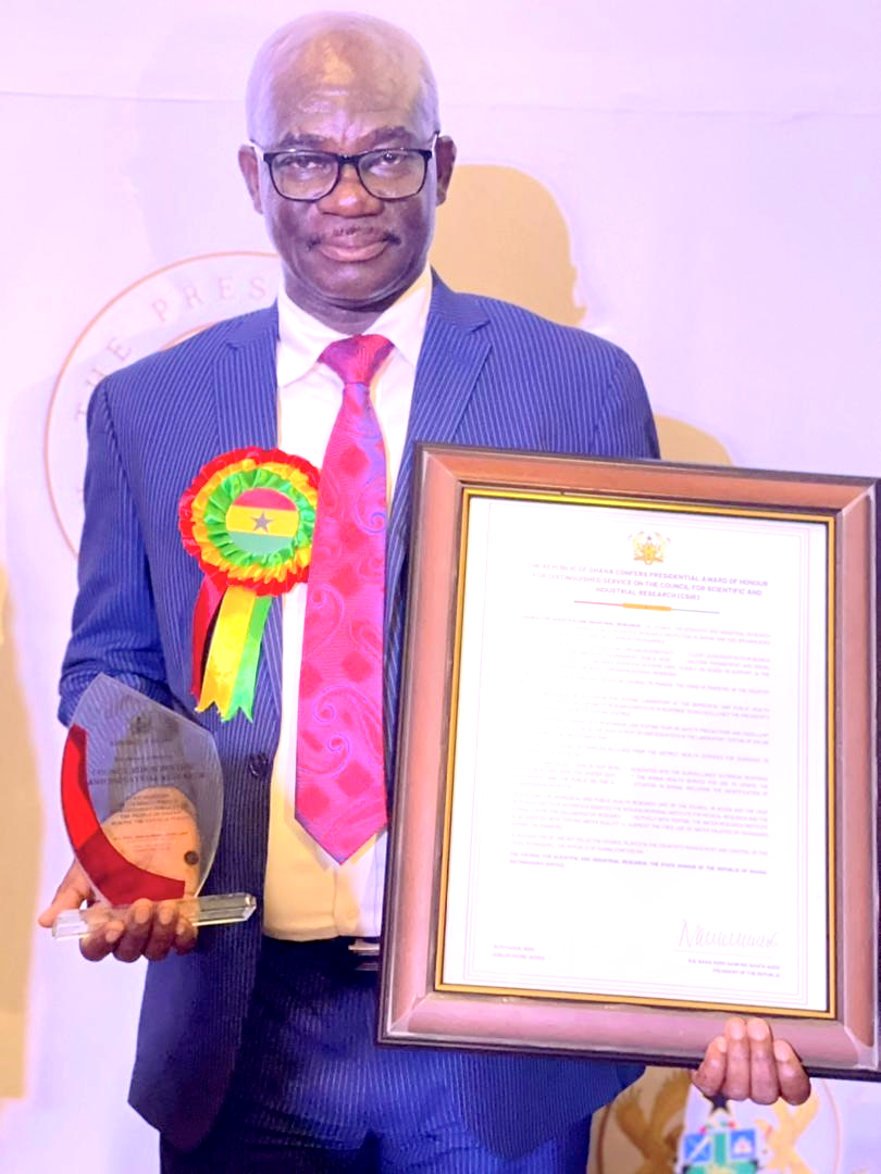 Prof. Atweneboana with his citation and plaque 